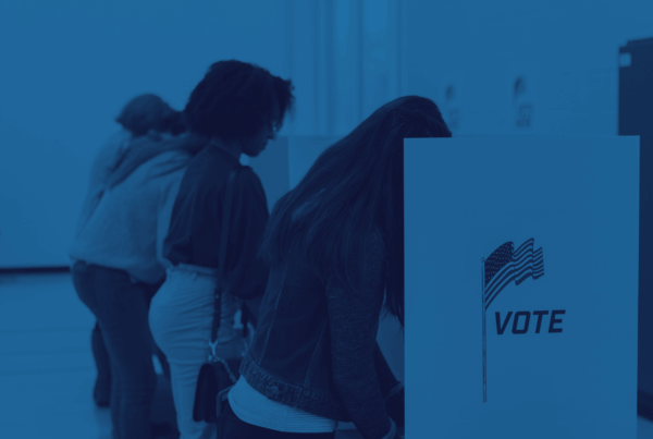 People voting with dividers between them.