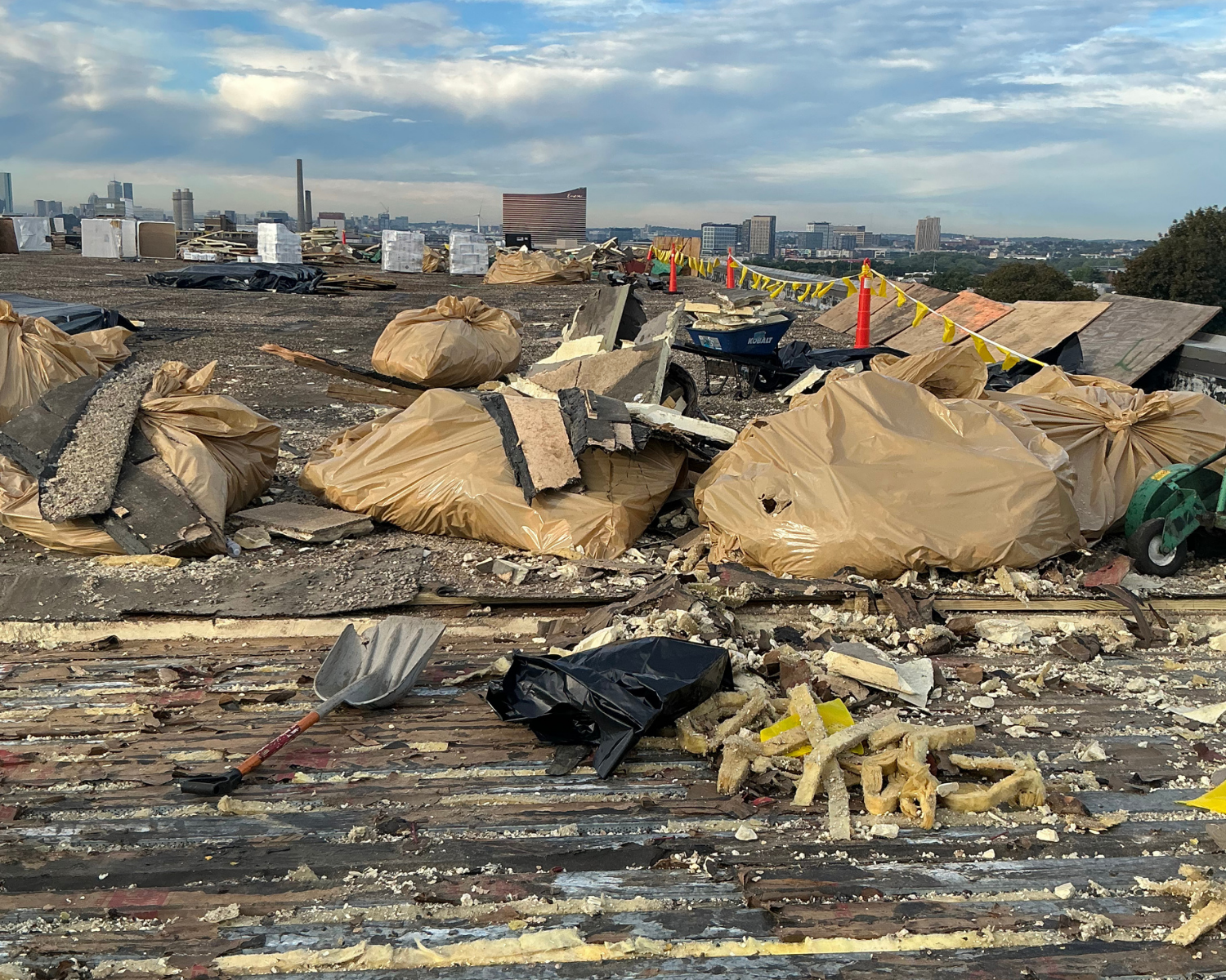 Wellness Center roof before construction, torn up with construction materials everywhere.