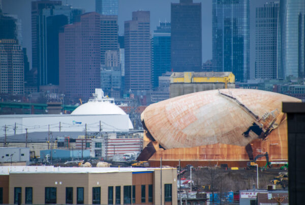 Drone shot of tank being torn down, looks almost like it's melting