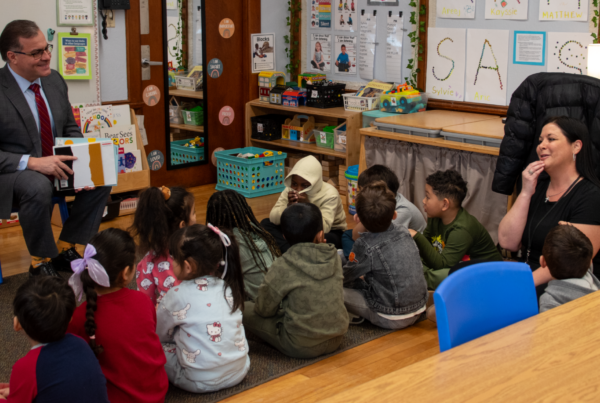 Mayor reading to young children in classroom