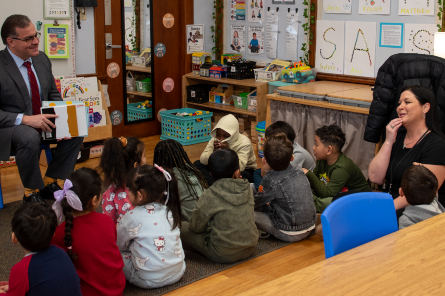 Mayor reading to young children in classroom