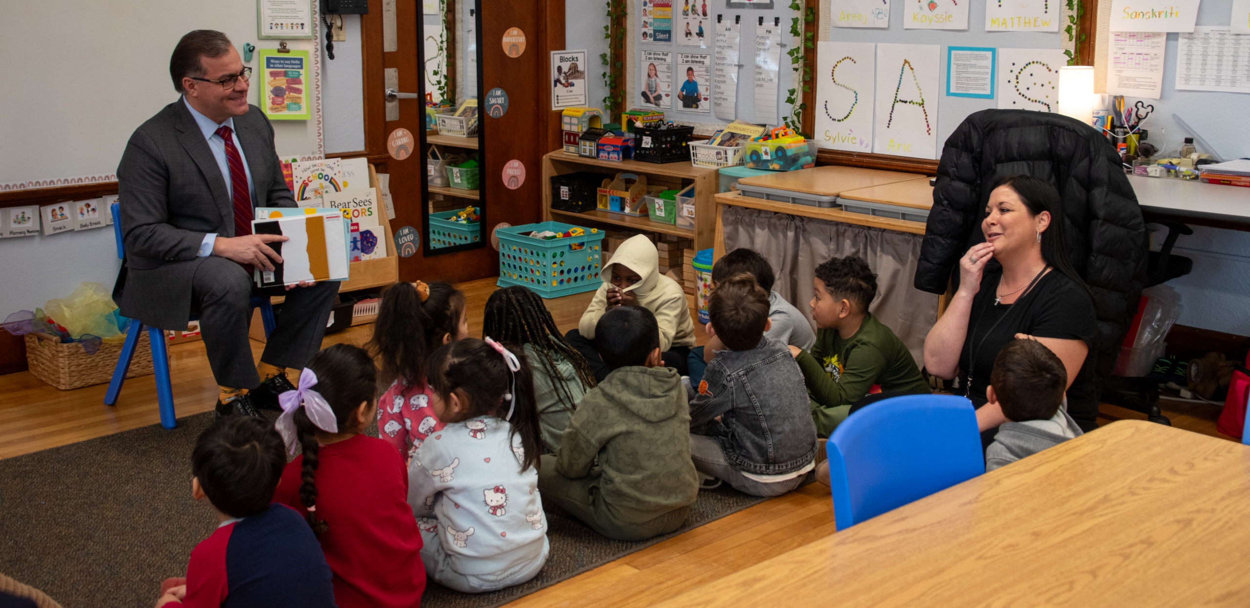 Mayor reading to young children in classroom