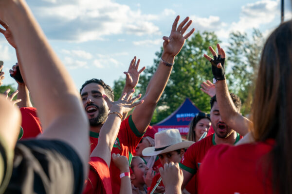 Morocco fans celebrate with a dance and team chant at Everett Fan Fest.