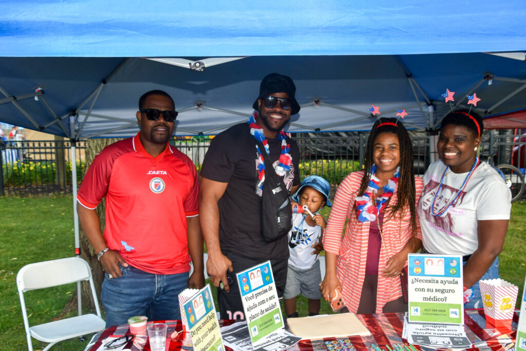 JCHCCE staff poses at their booth.