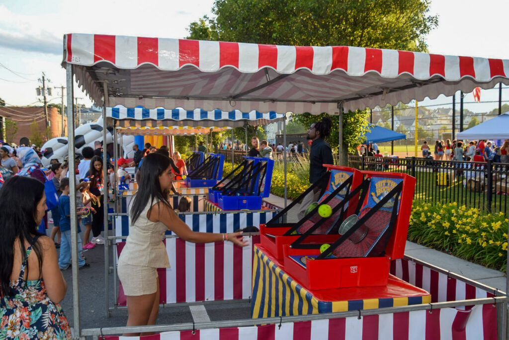 People enjoy the carnival games at Glendale.