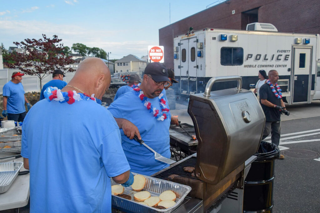 Volunteers barbecuing at the event.