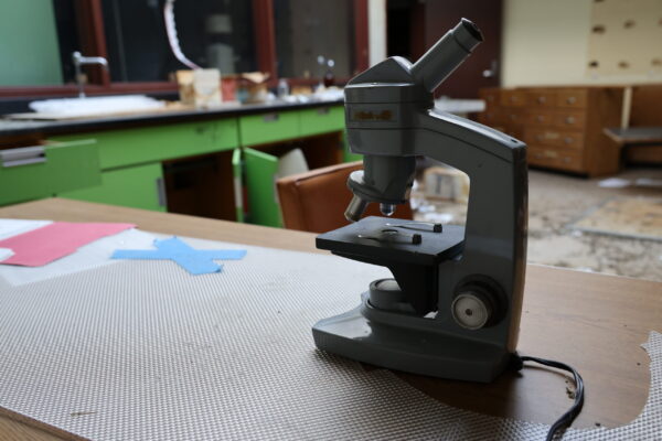 An old science lab tool sits on a table