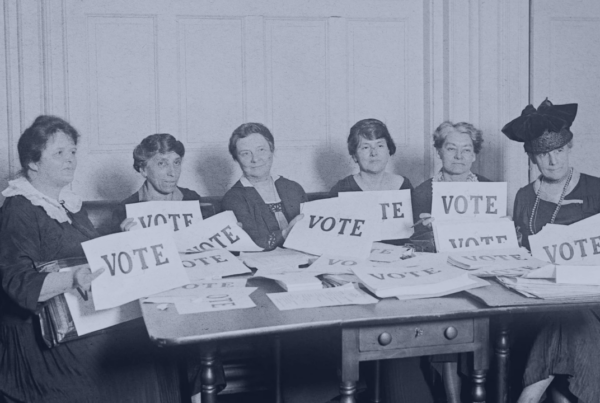National League of Women Voters holding "VOTE" signs in 1924.